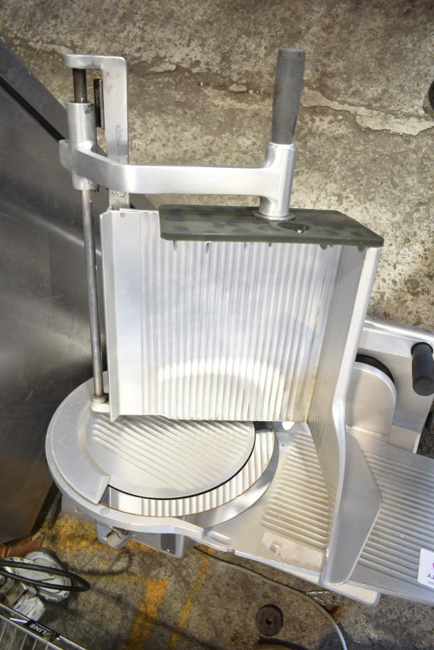 Bizerba SE 12 D commercial countertop meat slicer in good condition, 120 volts, 1 phase, features ribbed slicer plate.