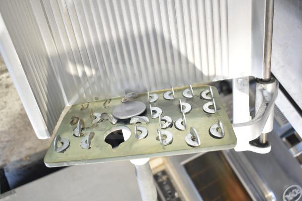 Bizerba SE 12 D commercial meat slicer, stainless steel. 120 Volts, 1 Phase. Visible residue, good condition, sturdy build.