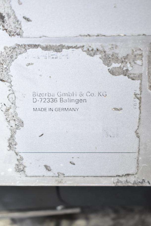 Bizerba SE 12 D commercial meat slicer plaque, showing company details and "Made in Germany" marking, 120V, 1 Phase.