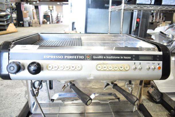 Brasilia OPUS-R-D-2 espresso machine with two portafilters, two steam wands, digital display, and multiple control buttons.