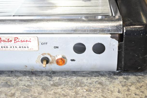 Brasilia OPUS-R-D-2 espresso machine control panel with on/off switch and light indicator. Visible wear on metal surface.
