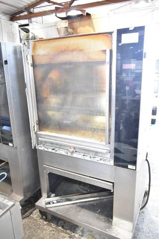 Fri-jado TDR7-P electric rotisserie oven, 208V, 3-phase, on casters. Note: broken glass visible on lower section.