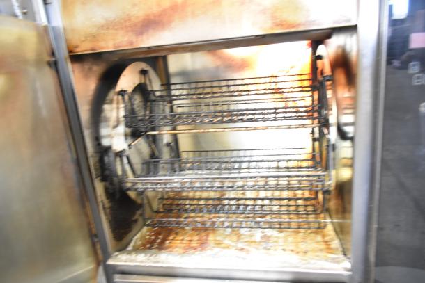 Fri-jado TDR7-P electric rotisserie oven with visible broken glass and wear, 208V, 3-phase, commercial casters.