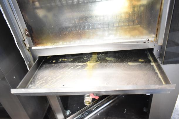 Fri-jado TDR7-P rotisserie oven with broken glass, dirty tray, on casters, 208V, 3-phase electric.