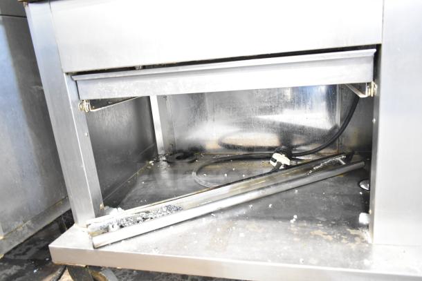 Fri-jado TDR7-P rotisserie oven; visible broken glass, electric, 208 volts, 3-phase, on commercial casters.