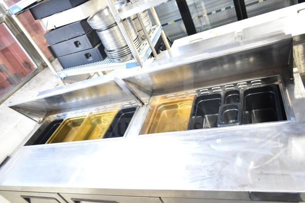 Atosa MSF8304 commercial sandwich prep table with stainless steel top, dual Bain Marie openings, and casters. 115V, 1 Phase.