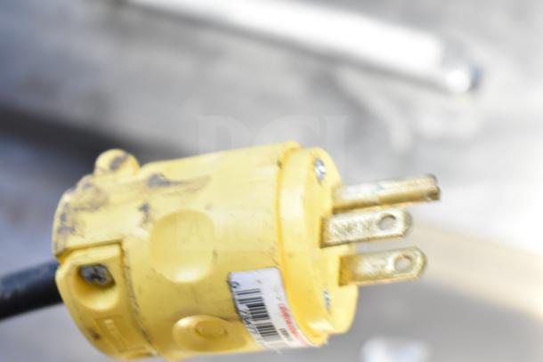 Yellow power plug for Atosa MSF8304 commercial prep table. Visible wear and barcoded label, indicating electrical compatibility.