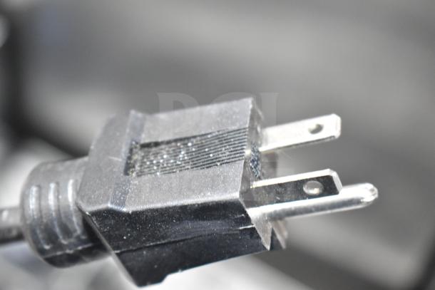 Brand new AvaMix 92850TB 5 Gallon Heavy-Duty Tilting Blender, 110 Volts. Close-up of power plug. Scratch and dent condition.