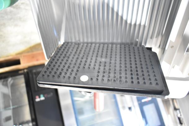 2020 Bizerba GSP HD commercial meat slicer tray. Stainless steel, 120 volts, 1 phase. Black textured platform.