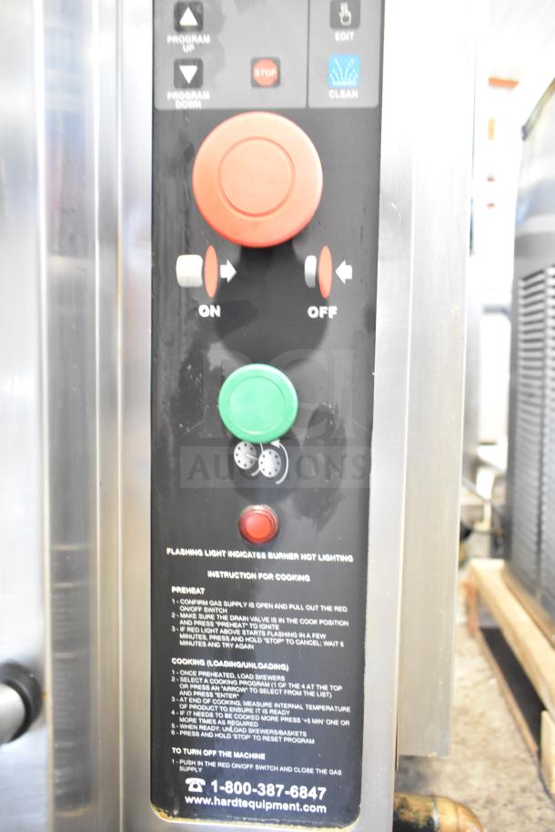 Hardt Inferno 4500 rotisserie oven controls with on/off switches, program buttons, and instructions visible.