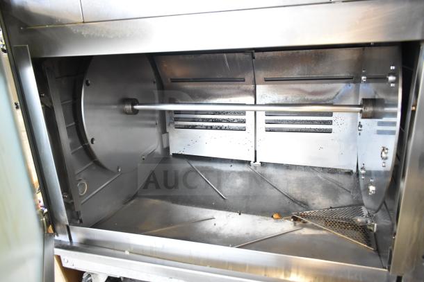 Hardt Inferno 4500 commercial rotisserie oven interior, stainless steel, 40 bird capacity, on casters, natural gas powered.