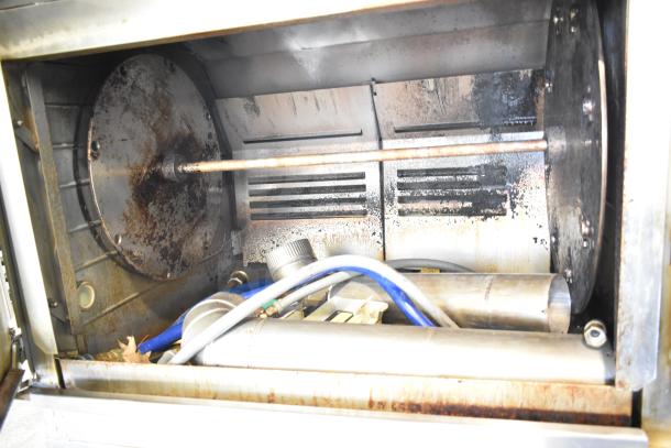 Hardt Inferno 4500 rotisserie oven interior, 40-bird capacity, 95,000-101,000 BTU, on commercial casters, used condition.