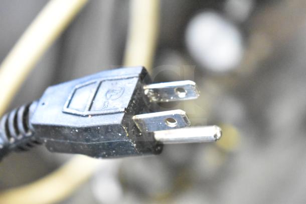 Close-up of an electrical plug end, possibly related to the Hardt Inferno 4500 commercial rotisserie ovens.