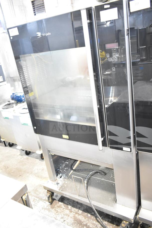 Fri-jado TDR7-P commercial rotisserie oven on casters, electric, 208V, 3 phase, good condition, stainless steel exterior.