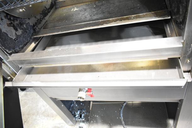 Fri-jado TDR7-P rotisserie oven with interior view. Stainless steel, commercial casters, 208V, 3 phase. Used condition.