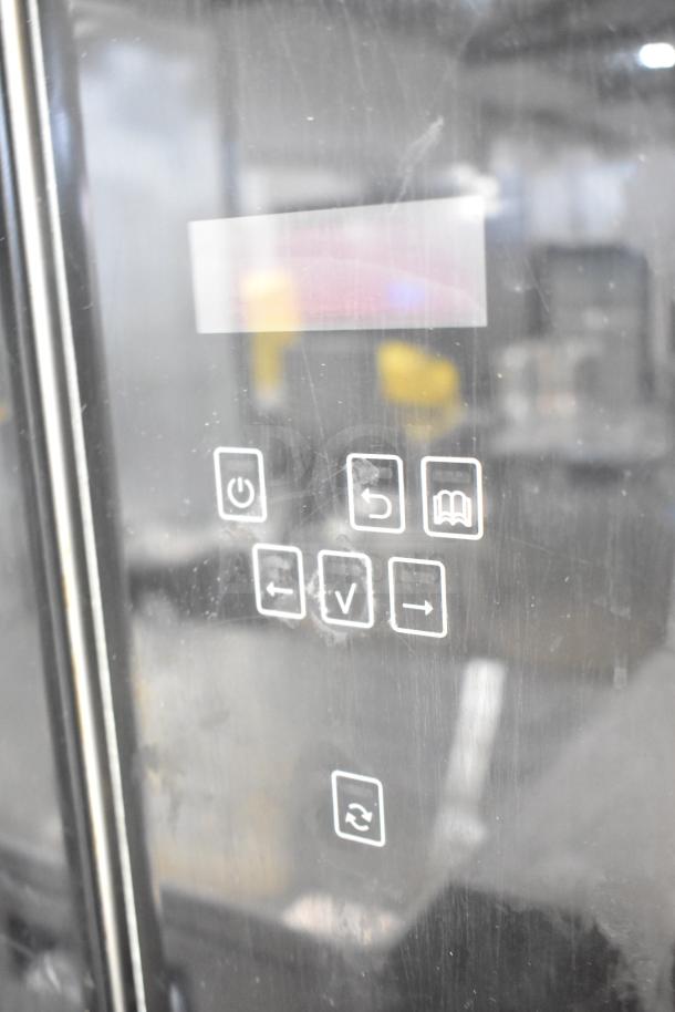 Fri-jado TDR7-P electric rotisserie oven with digital controls, on commercial casters. 208 Volts, 3 Phase. Visible control icons.