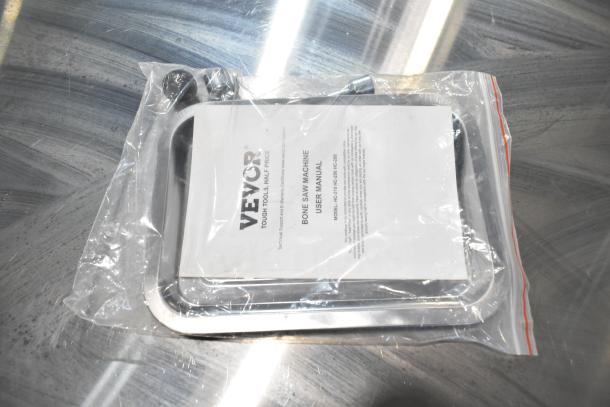 Vevor HC-250 Commercial Bone Saw Machine user manual in clear plastic. Model and make details visible.