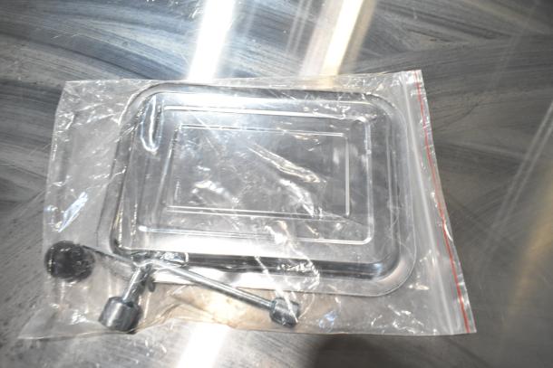 Zipped bag containing parts for Vevor HC-250 Bone Saw. Includes metal tray and accessories, in excellent condition.