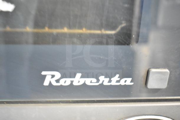 Cadco Unox XAF003 Roberta convection oven, black finish, visible Roberta branding. 120V, commercial use.