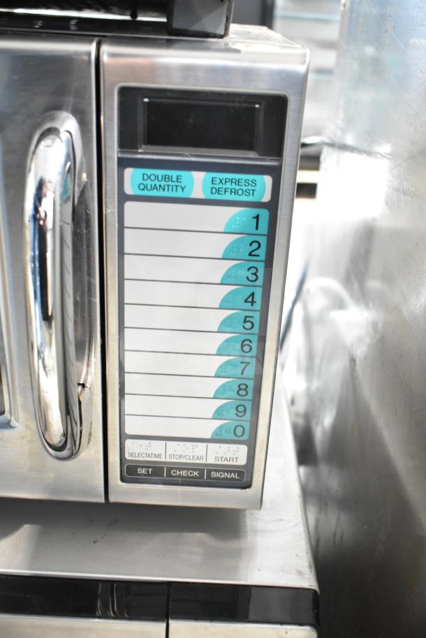 2021 Sharp R-21LVF commercial microwave oven, stainless steel finish, keypad with double quantity and express defrost options.