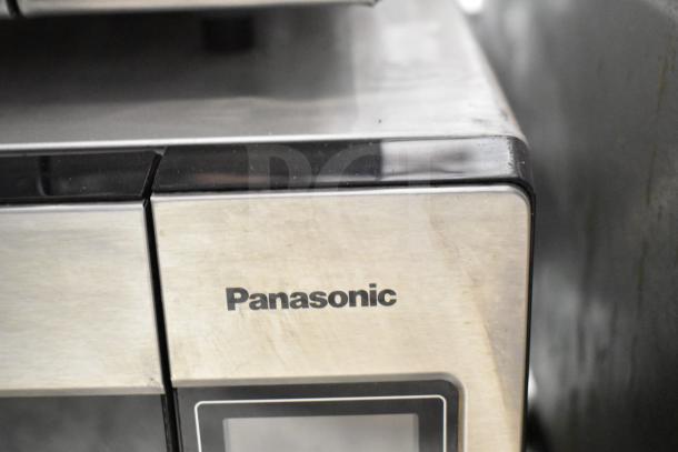 2021 Panasonic NN-T945SFX countertop microwave oven, stainless steel, with plate, 120 volts, 1 phase, visible logo.