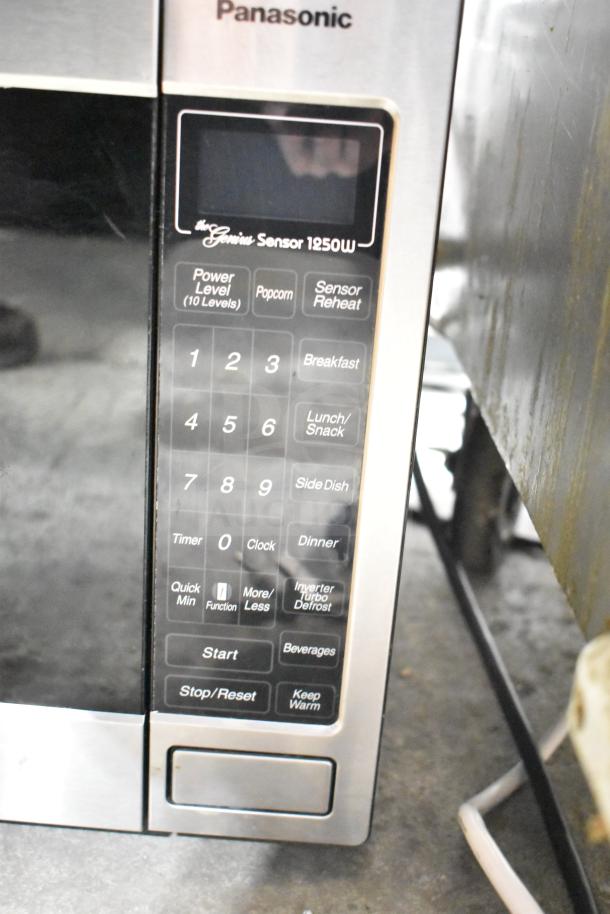 2021 Panasonic NN-T945SFX Microwave Oven, countertop model, 1250W, sleek design, features 10 power levels, sensor reheat.