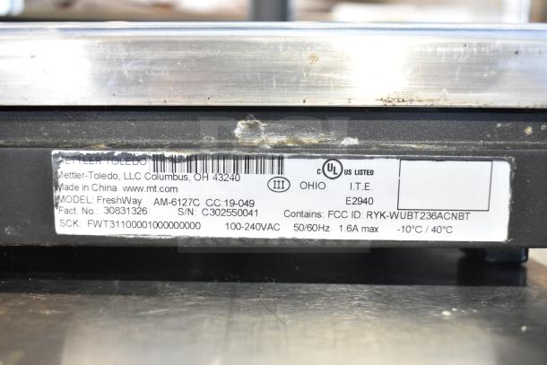 Mettler Toledo FreshWay portioning scale label, model AM-6127C, 100-240VAC, 1.6A max, UL listed, used condition.