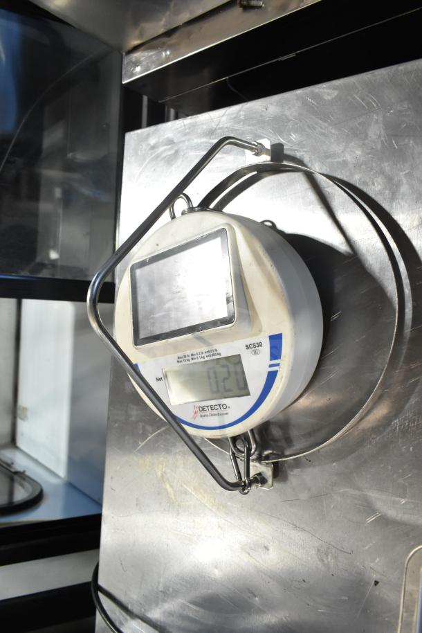 Detecto SCS30 produce scale on metal mounting; clear digital display; good condition; Detecto branding visible.