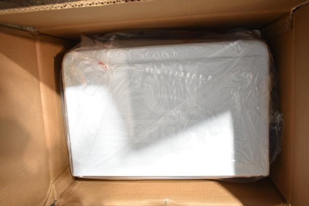 Brand new Galanz 0.7 Cu ft retro microwave in original packaging, showing minor scratches or dents.