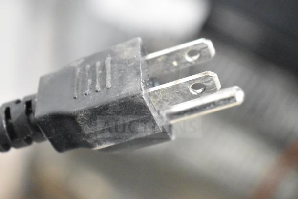 Close-up of a power plug from the 2018 Hobart HTi-LH26 commercial food portioning scale. Tested and working condition.