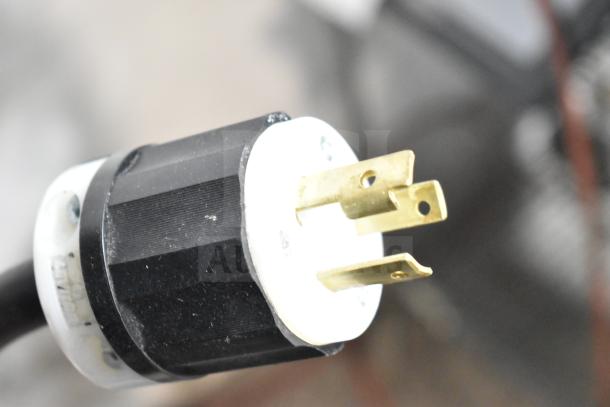 A black and white electrical plug for the Imperial IRTC-32-E-2 Commercial Pasta Cooker Rethermalizer, 208 Volts, 1 Phase.