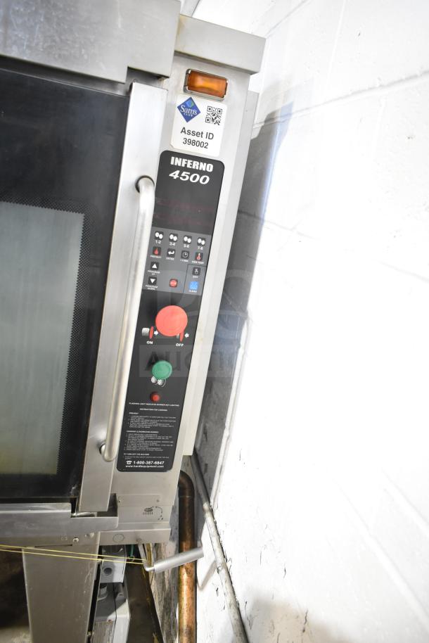 Hardt Inferno 4500 stainless steel rotisserie oven, natural gas, with skewers, metal legs, and commercial casters. Asset ID 398002.