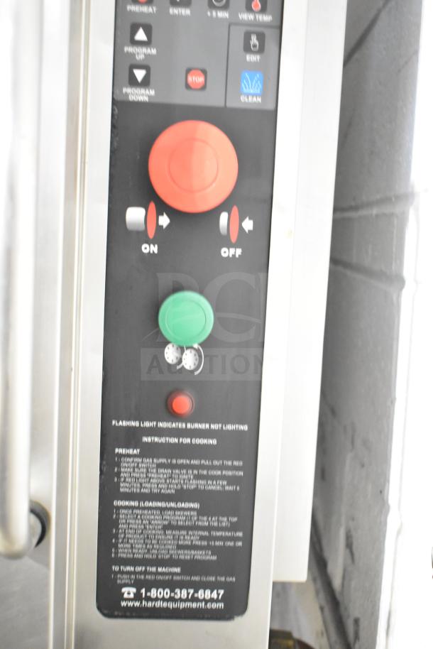 Hardt Inferno 4500 rotisserie oven control panel with on/off buttons and cooking instructions.