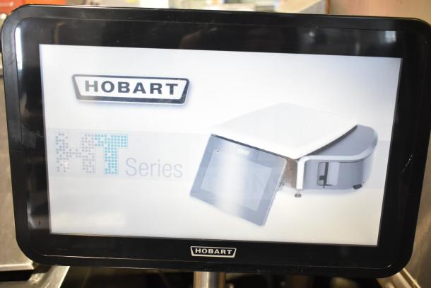 2023 Hobart HTi-SSLSC Commercial Food Portioning Scale on stand. Model shown on screen with Hobart logo.