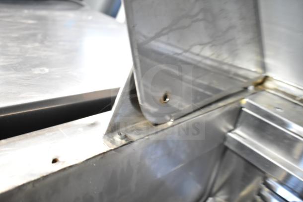 Coldline SMP-48 Commercial Sandwich Prep Table close-up. Stainless steel, slight wear visible. Model SMP-48, 115 Volts, 1 Phase.