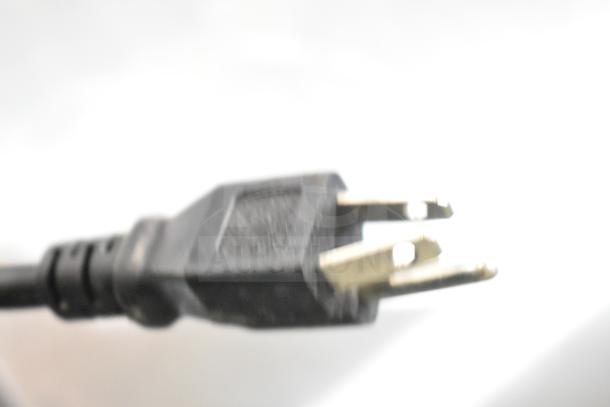 Coldline SMP-48 power plug, 115 volts, 1 phase. Black with three prongs. For commercial sandwich salad prep table.