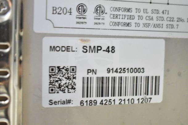 Coldline SMP-48 sandwich salad prep table label showing model, certifications, and serial number.