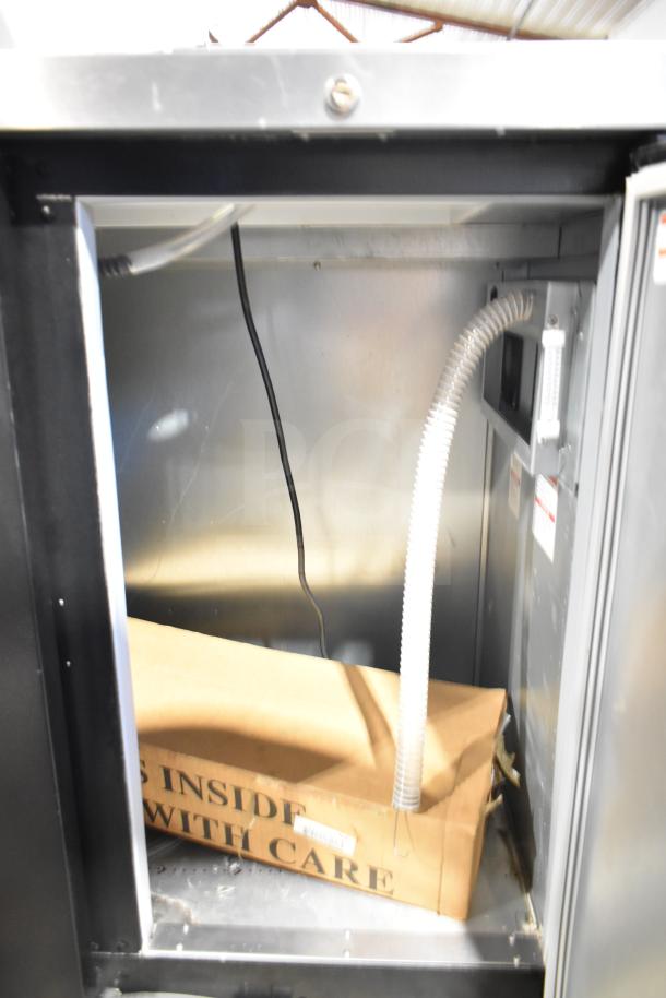 Beverage Air DD48HC-1-B Commercial Kegerator, interior view, showing refrigeration components and care instructions.