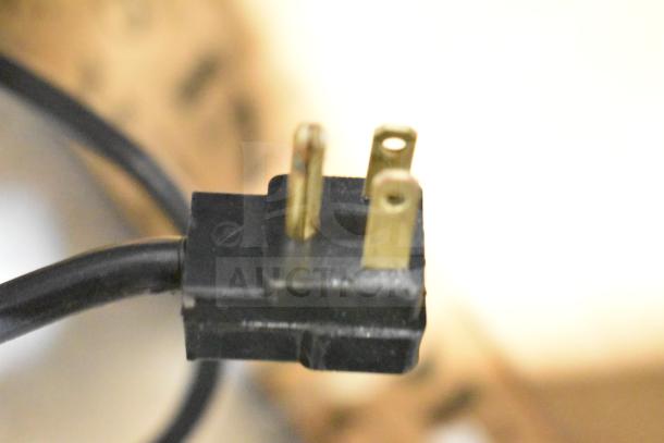 Close-up of a power plug from a Beverage Air DD48HC-1-B kegerator, 115 volts, 1 phase. Plug shows three prongs.