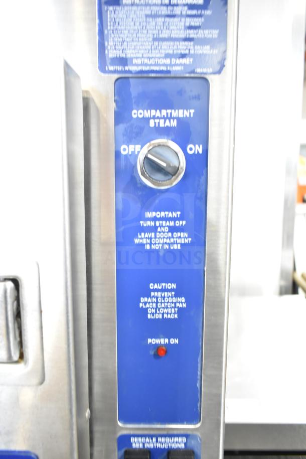 Cleveland 24CGA6.2S steam cabinet control panel, blue display with steam switch, instructions, and power indicator light.