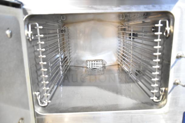 Cleveland 24CGA6.2S steam cabinet interior with dual racks, stainless steel, 50,000 BTU, commercial-grade, natural gas.