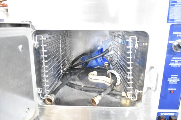 Cleveland 24CGA6.2S 2-deck steam cabinet, stainless interior, visible hoses, natural gas, 50,000 BTU, commercial use.