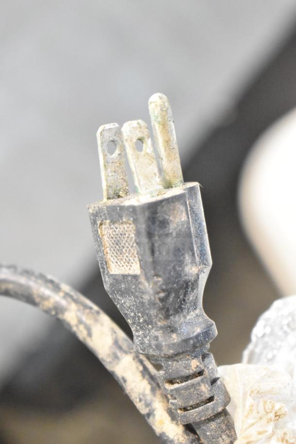 Worn 115V power plug of Universal Commercial 2 Door Undercounter Cooler, showing signs of heavy use.