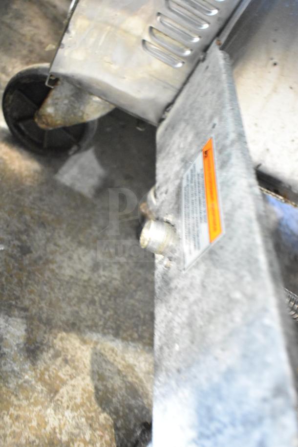 Pitco Frialator 40C natural gas fryer, 122,000 BTU, commercial use. Visible wear, wheels shown, inspection required.