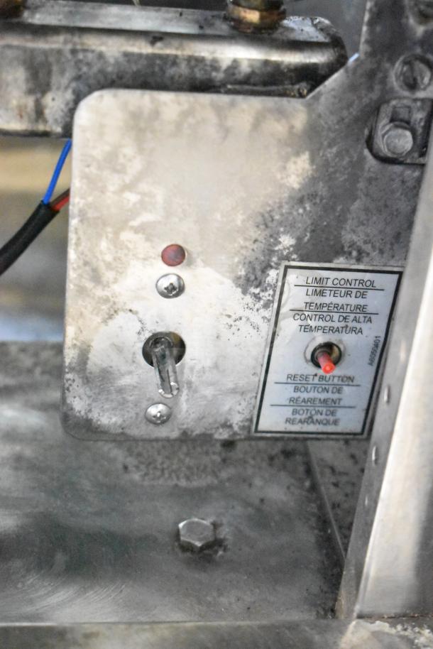 Close-up of Pitco Frialator 40C fryer control panel. Shows limit control, reset button, and a 122,000 BTU capacity.