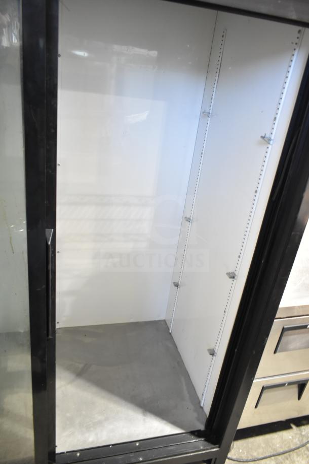 True GDM-45-LD Commercial Cooler, 2-door, reach-in, 115V, 1 Phase, steel interior, black frame, shelves not included.