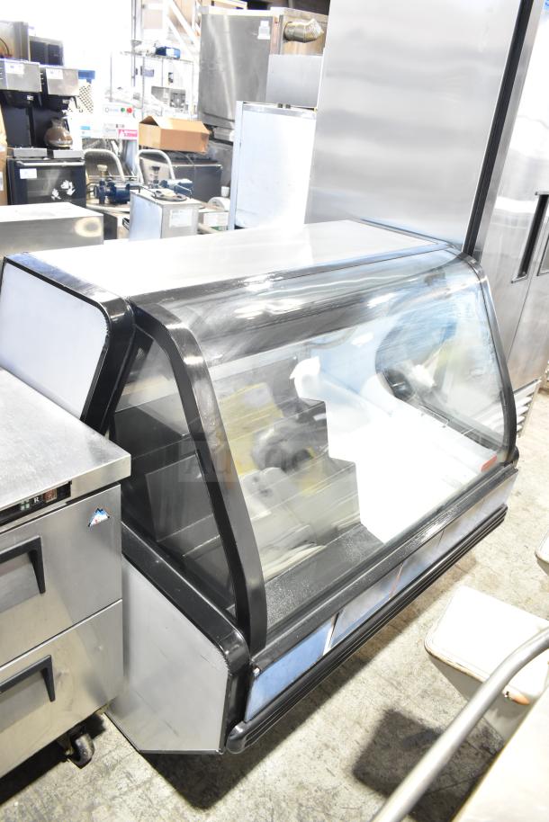 Torrey TEC130L-UL commercial deli display case, 127V, 1 Phase. Glass front, black trim, good condition.