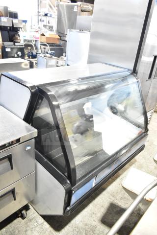 Torrey TEC130L-UL commercial deli display case, 127V, 1 Phase. Glass front, black trim, good condition.