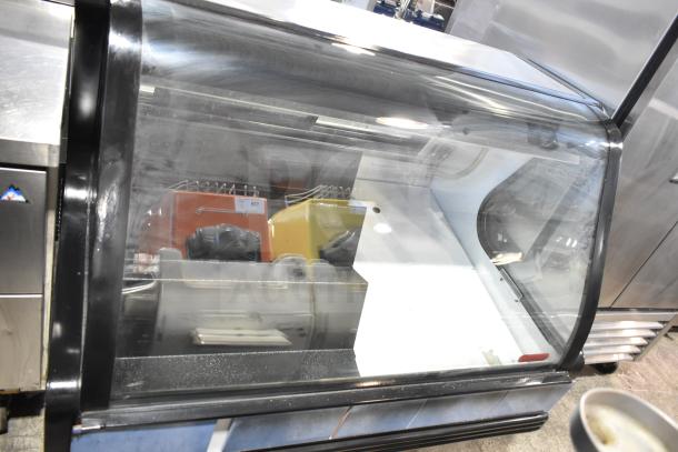 Torrey TEC130L-UL commercial deli display case, 127 volts, 1 phase. Clear glass exterior, metal frame, good condition.