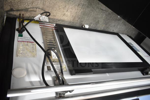 Torrey TEC130L-UL Commercial Deli Display Case, 127V, 1 Phase, clean condition, visible electrical outlet and user instructions.